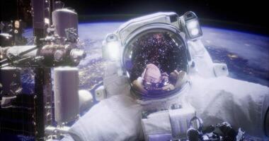 The CGI Astronaut floating in space near the International Space Station at night video