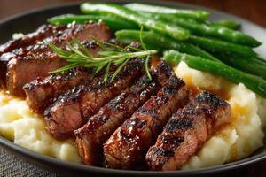 A mouthwatering plate features perfectly grilled steak, creamy mashed potatoes, and vibrant green beans, all beautifully arranged photo