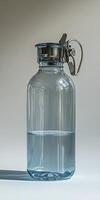 A large glass jar with a metal handle photo