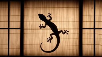 A lizard clings to a shoji screen, casting a striking silhouette during the evening. photo