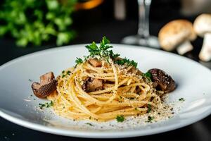 Delicious Spaghetti With Mushrooms and Herbs Served in a Modern Restaurant Setting photo