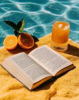 Enjoying a Sunny Afternoon by the Pool With a Book and Refreshing Drink. photo