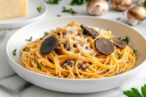 Delicious Spaghetti With Truffle and Parmesan Served on a White Plate With Fresh Herbs and Mushrooms photo