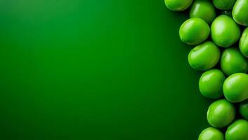 Green olives on a bright BG. Plump green olives cluster together against a rich green backdrop, highlighting their fresh appearance and color. photo