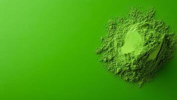 Green powder on a vibrant background. Bright green powder rests on a smooth surface, showcasing its fine texture and vivid color. photo