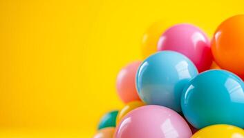Pastel eggs on a bright background. Brightly colored eggs in pastel shades are stacked against a vibrant yellow backdrop, creating a festive atmosphere. photo