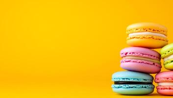 Vibrant macaron stack. Pastel macarons are artfully stacked on a bright yellow background, highlighting their delicious textures. photo