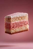 A delightful three layered pink cake, adorned with delicate sprinkles and creamy frosting. This sweet treat is perfect for satisfy photo