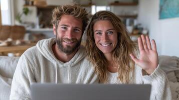Happy Couple Calling from Home. Smiling man and woman having a chat on laptop, waving hello. Modern lifestyle, technol photo