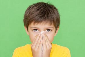A Young Boy with a Cold Portrait of a Sick Child, Healthcare and Illness Concept photo