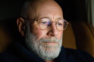Pensive Senior Man Portrait A Study of Age, Wisdom, and Contemplation. The image captures a moment of quiet reflection, highlight photo
