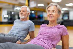 Active Senior Couple Enjoying a Fitness Workout at the Gym. Healthy Lifestyle, Exercise, and Wellness for Older Adults. Strength photo
