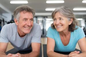 Active Senior Couple Fitness Plank Exercise for Strength and Wellness. A healthy lifestyle journey of a mature man and woman work photo