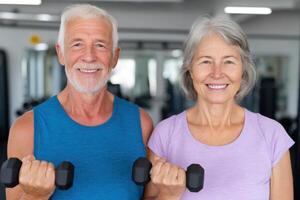 Active Seniors Fitness Couple Weightlifting at the Gym. Healthy Aging, Exercise Motivation, and Strength Training for Older Adult photo