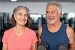 Active Senior Couple Working Out at the Gym Fitness and Wellness in Retirement. Maintain strength and vitality with a healthy lif photo