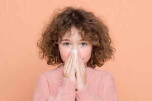 A Young Girl with a Cold Symptoms, Treatment, and Healthcare. This image depicts a child experiencing cold symptoms, highlighting photo