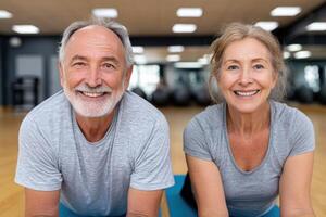 Active Senior Couple Smiling After Fitness Workout at the Gym. Healthy Lifestyle, Wellness, and Active Aging Concept photo