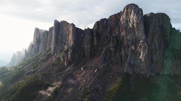 Rocks of Bolshoy Tkhach mountain with fog and video
