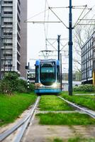 Discover the modern urban landscape of Rotterdam with its electric trams, a sustainable and convenient public transit system that enhances the city's mobility. photo