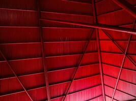 Rustic steel roof in red color, geometric background for aesthetic, modern, minimalist concept photo