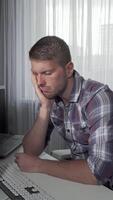Exhausted man dozing off at his computer desk video