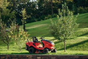 Lawn mover, is, on the green grass at daytime photo