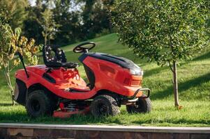 Lawn ,mover, is on the green grass at daytime photo