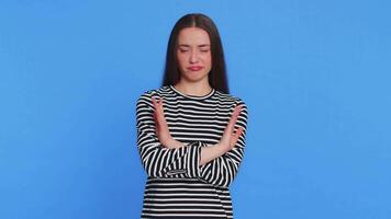 I am not guilty. Caucasian woman in striped blouse pointing fingers herself ask say who me no thanks i do not need it, feels innocent, not her fault, fail mistake. Girl isolated on blue background video