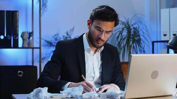 Angry furious Indian man working at office throwing crumpled paper, having nervous breakdown at work, migraine headache, stress management, mental distress problems, losing temper, reaction on failure video