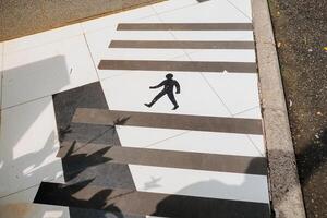 signs for pedestrians on the floor of a building photo