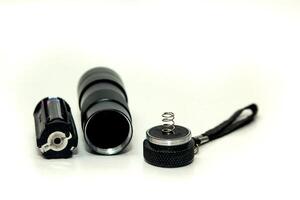 Disassembled flashlight components photo
