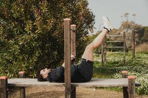 Man Does Intense Exercise Using City Park Structures photo