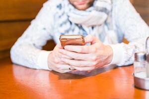 Close up of a man using mobile smart phone photo