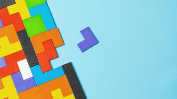 geometric shape block with colorful wood puzzle piece background. logical thinking, business logic, Conundrum, decision, solutions, rational, mission, goals and strategy concepts photo