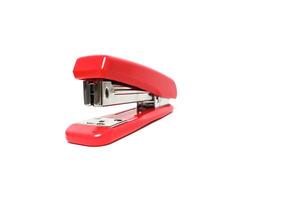 A vivid red stapler isolated on a pristine white backdrop, showcasing its functional design photo