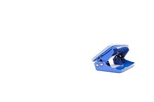 A Single Blue Hole Punch Isolated on White Background in a Studio Shot, Perfect for Stationery Product Mockups and Design Assets photo