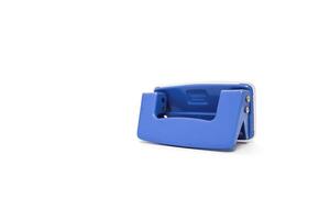 Isolated blue hole punch stationery item for office use and creative paper crafting projects with a clean white background photo