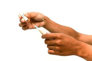 Hands Assembling Glucose Meter Components for Diabetes Monitoring photo
