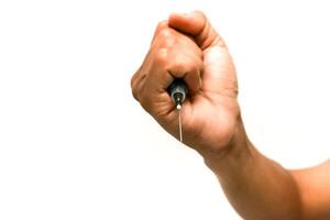 Close-up of a hand holding a lancing device for glucose monitoring, isolated on a white background in a studio setting photo