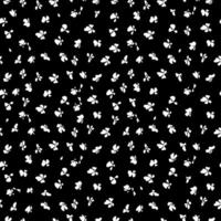 A black and white pattern with white flowers vector