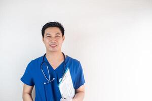 Asian Male Nurse Holding Clipboard and Smiling in Uniform photo