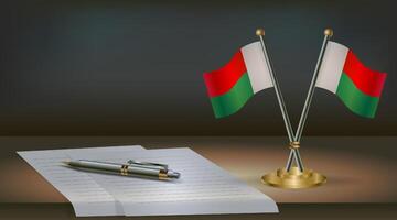 Madagascar table flag on a dark gradient color background table. Illustration vector