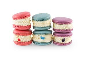 Colorful macaron cakes. Small french muffins. Colorful macarons on a white background with clipping path. photo