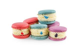 Colorful macaron cakes. Small french muffins. Colorful macarons on a white background with clipping path... photo