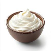Whipped cream in brown bowl isolated on white background photo