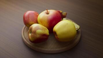 Looping animation around a composition of apples lying on a wooden board. video