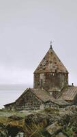 Timelapse Sevanavank monastic complex building with Sevan lake view. Peninsula at the northwestern shore of Lake Sevan in the Gegharkunik Province Armenia. Popular travel sightseeing attraction video