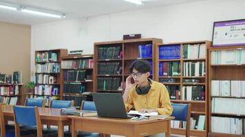 Student university man in library, laptop and typing online learning. video