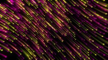 Colorful light trails swirl in abstract pattern against dark background during nighttime display video