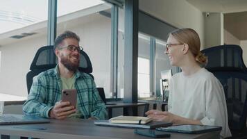 Business consultant are engaging in productive meeting, exchanging ideas and collaborating on project in modern office environment, utilizing technology and notebooks. Business consultant In work video